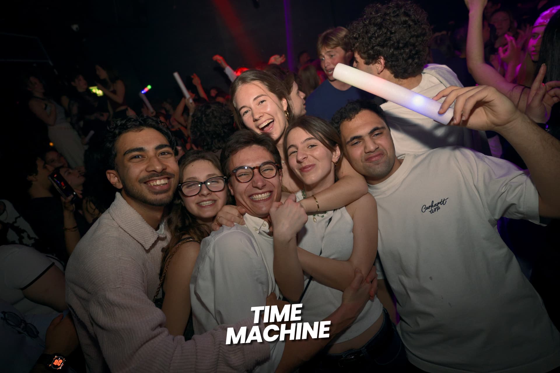 Group of friends celebrating together on the dancefloor